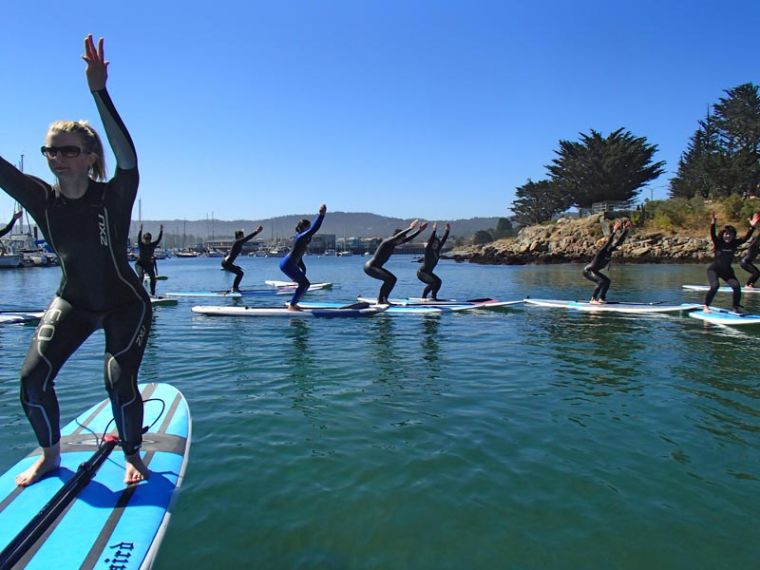 The latest wave in a genre swimming with them: paddleboard yoga.